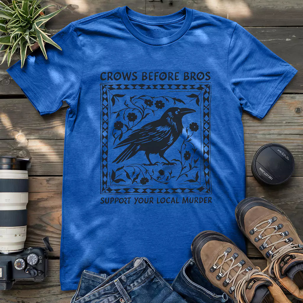 Royal blue shirt featuring gothic raven graphic and witty “Crows Before Bros” slogan