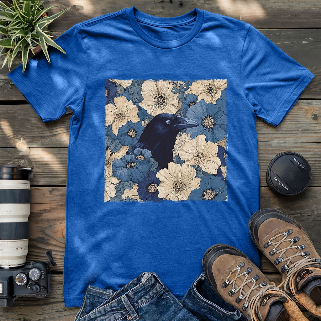 Bold raven in vintage floral artwork on royal blue t-shirt