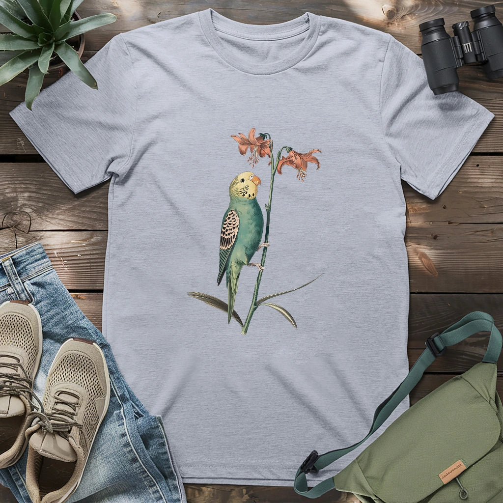 Beautiful budgerigar perching on lily shirt.