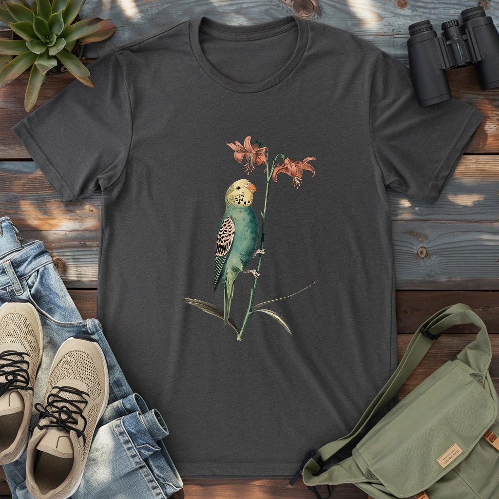 Beautiful budgerigar perching on lily shirt.