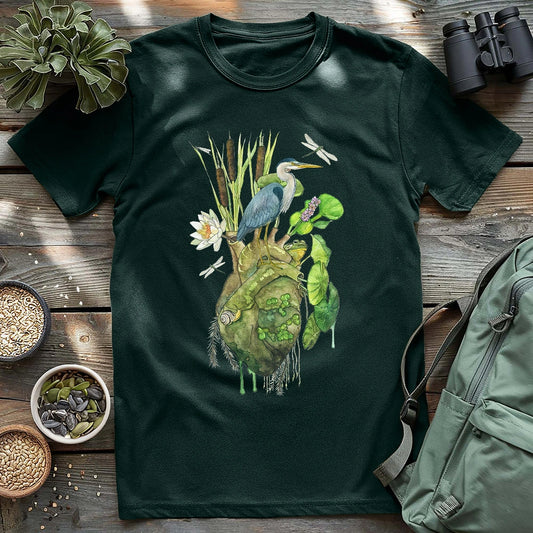 Forest green heron graphic t-shirt featuring a heron on a heart-shaped pond design